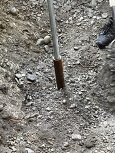 New valve covered with backfill (extension housing visible)